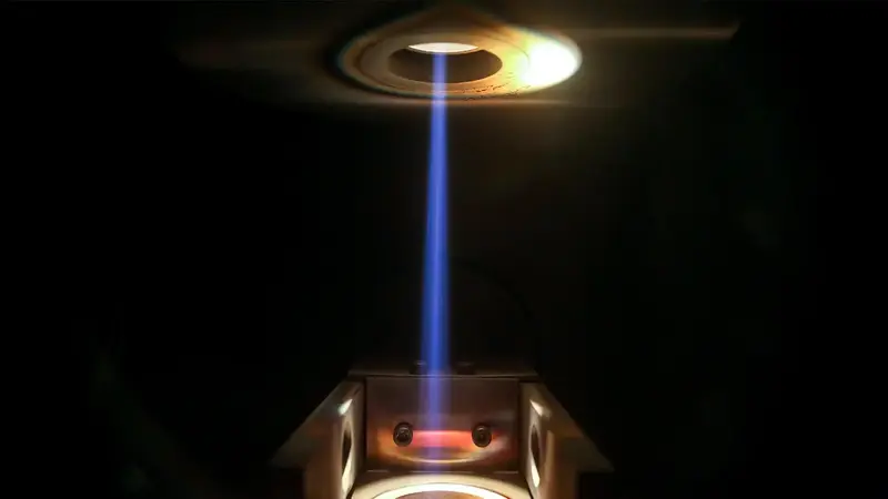 Perspective view of an electron beam evaporation process in vacuum.