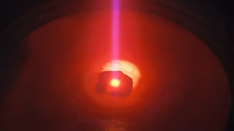 Perspective view of an electron beam melting process in vacuum.